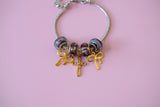 Cross & Bow Charm Bracelet