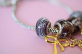 Cross & Bow Charm Bracelet